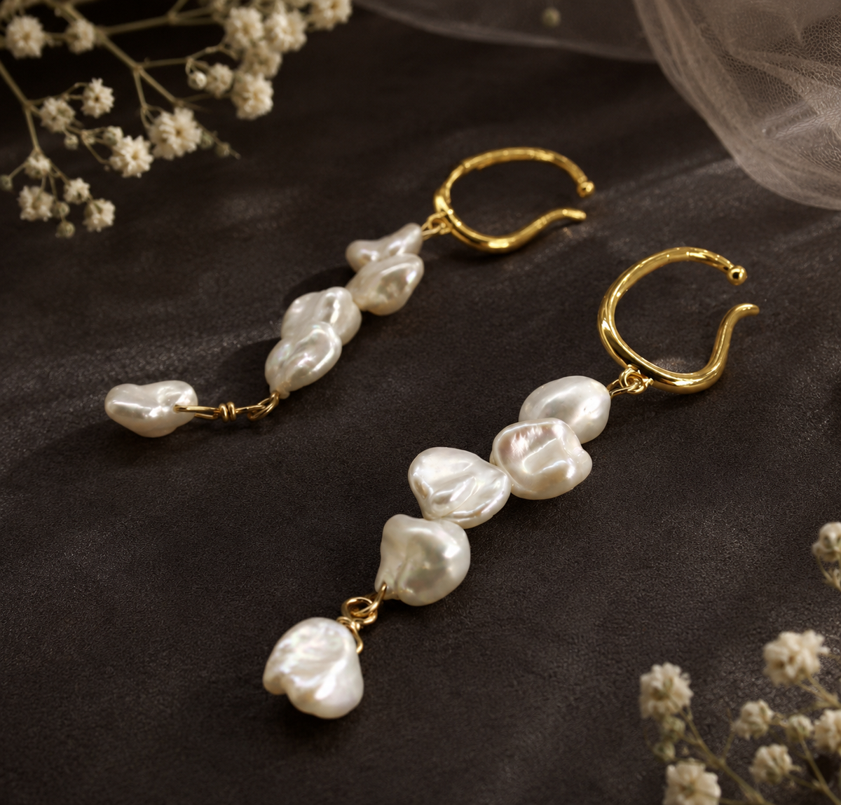 Organic gold-tone open hoops with cascading white baroque freshwater pearls