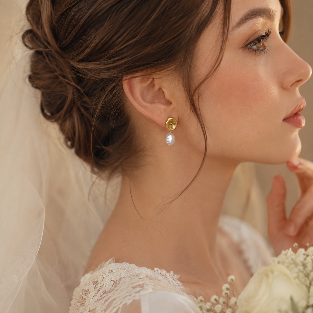 Bride wearing the single-pearl side of asymmetric freshwater pearl earrings