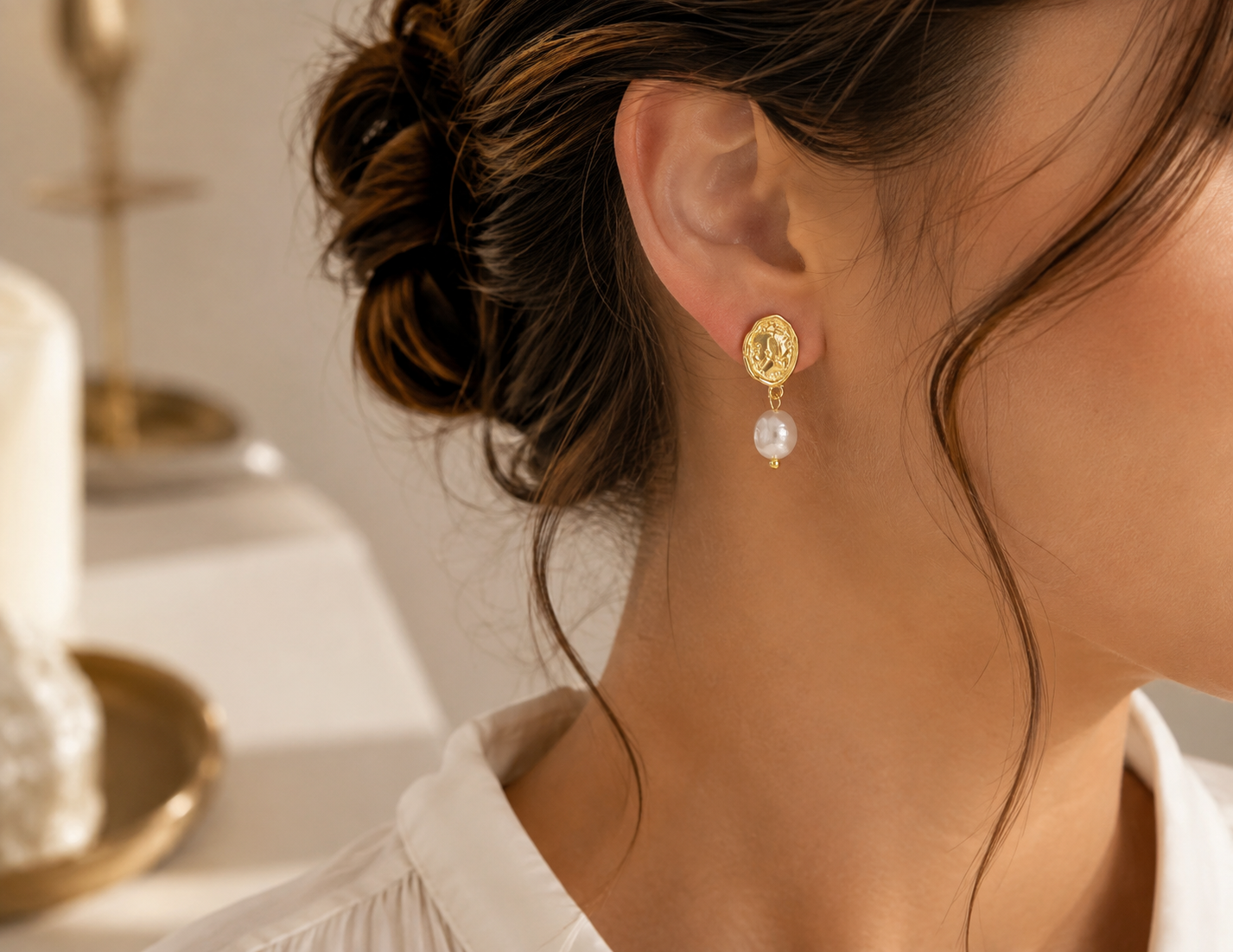 Woman wearing freshwater pearl vintage coin drop earrings