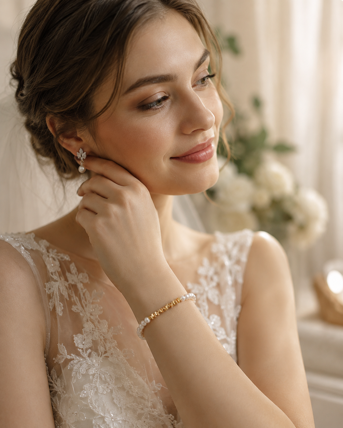Bride wearing a white pearl and gold-tone beaded bracelet with her wedding dress