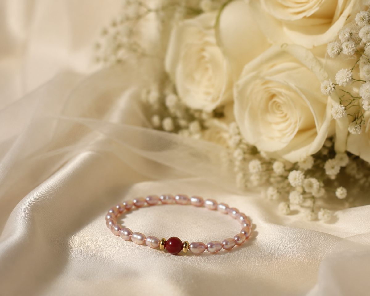Slip on bracelet with petite pink freshwater pearls and a contrasting red stone