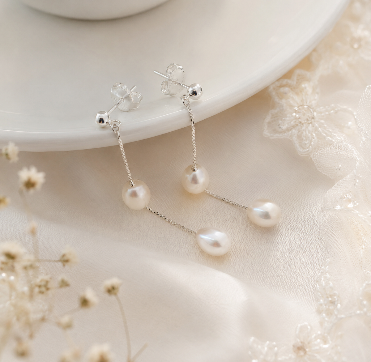 Pair of S925 sterling silver chain earrings with two white freshwater pearls on each earring