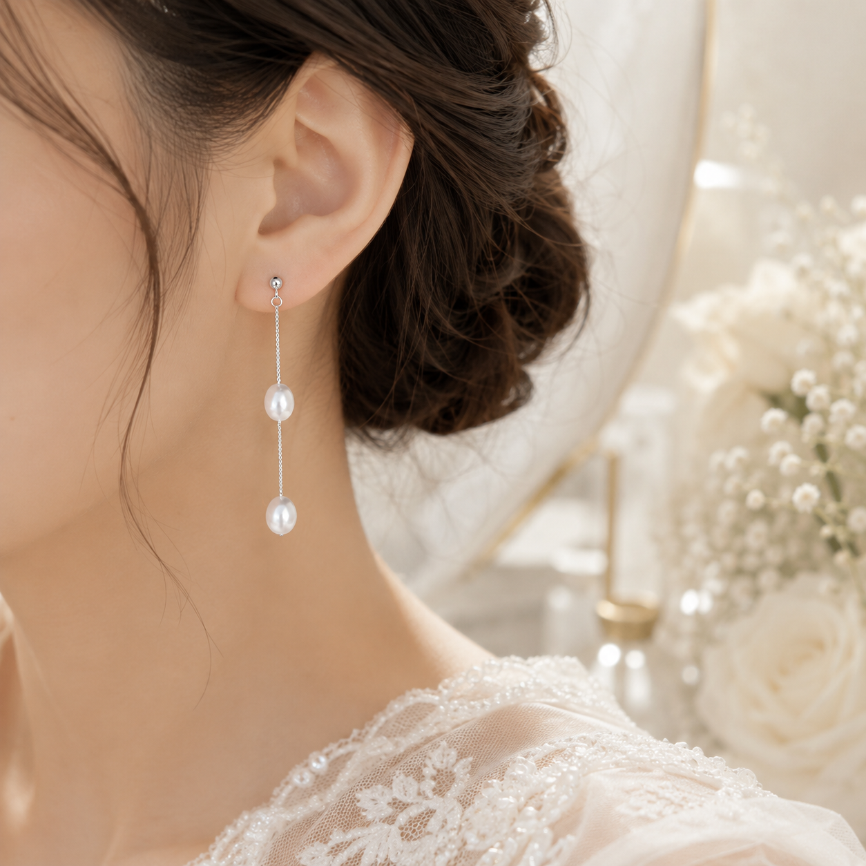 Side view of a bride wearing S925 sterling silver dangle earrings with two white pearls