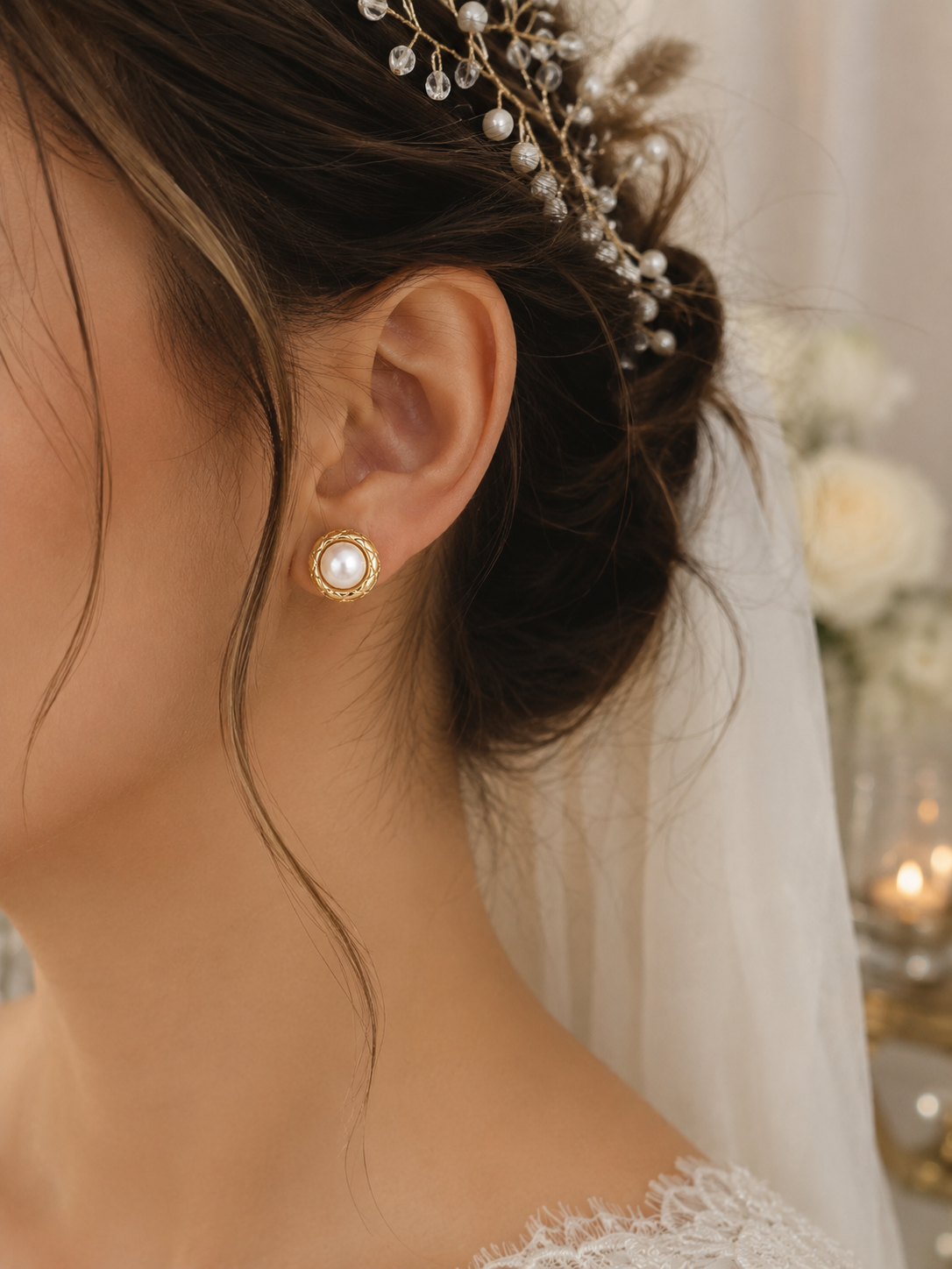 Bride wearing vintage-inspired pearl studs with detailed gold borders