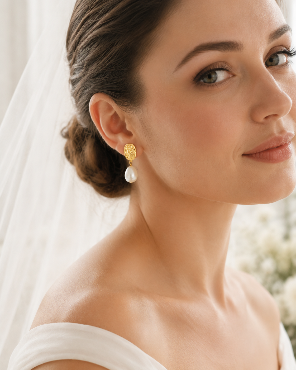 Front bridal portrait with white baroque pearl and textured gold drop earrings