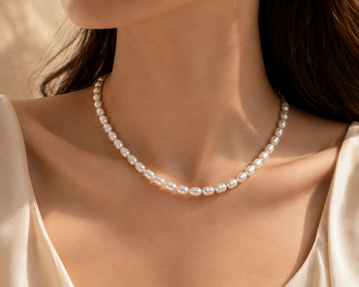 Close-up of genuine white freshwater rice pearls worn around the neck
